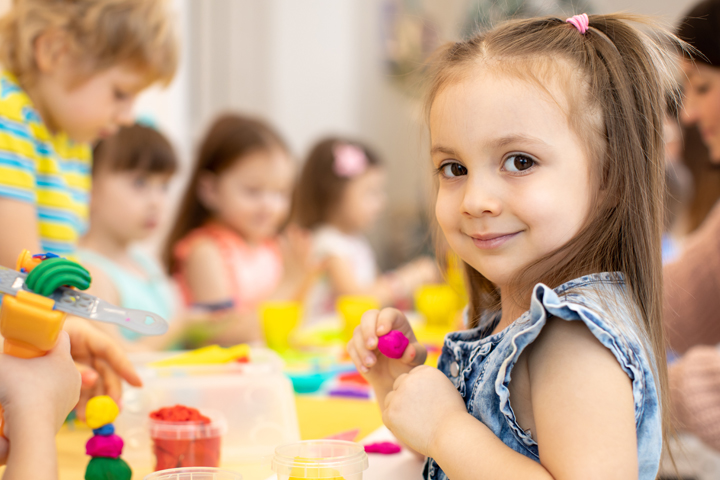 Photo of young people playing with playdough