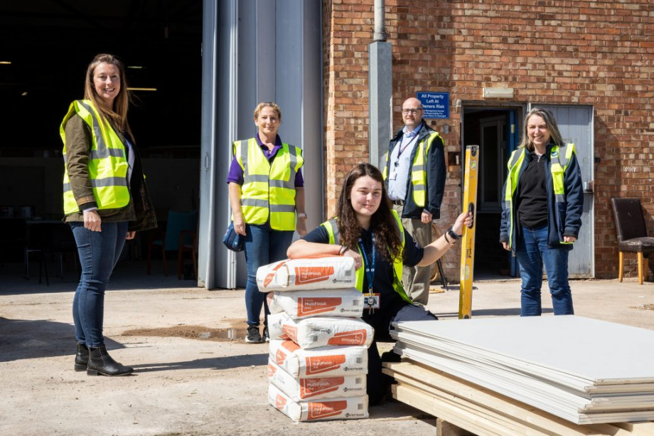 Photo of people on a construction site, wearing high visibility jackets