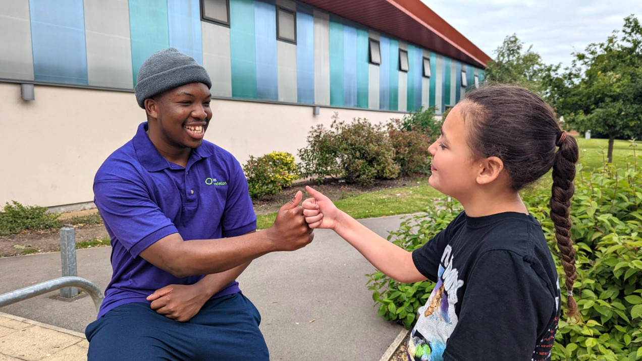 Photo of two people fist bumping at FireFit Hub